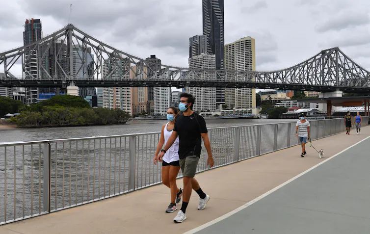 People walking in Brisbane wearing masks