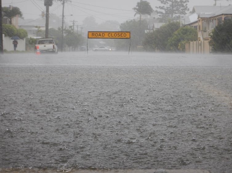 Floodwaters cut off a road.