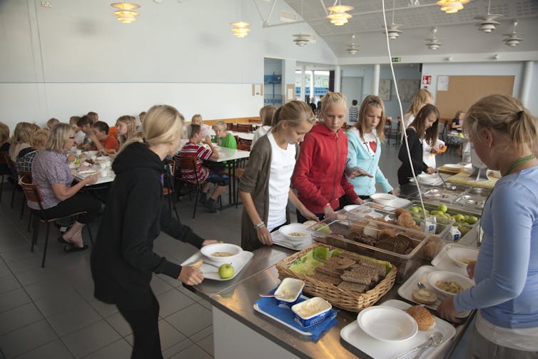 School children getting lunch in a canteen