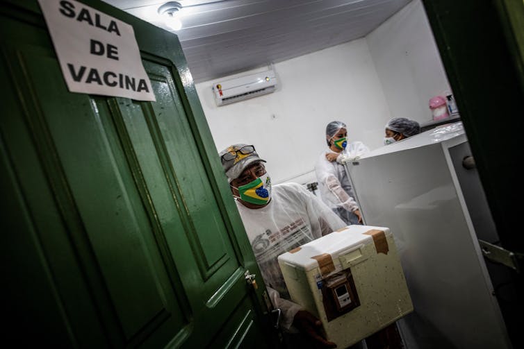 Health workers in Brazil involved with COVID vaccinations