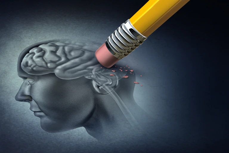 Pencil erasing a drawing of a human brain.