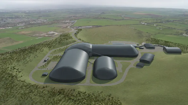 Digitally rendered curved black buildings amid green fields.
