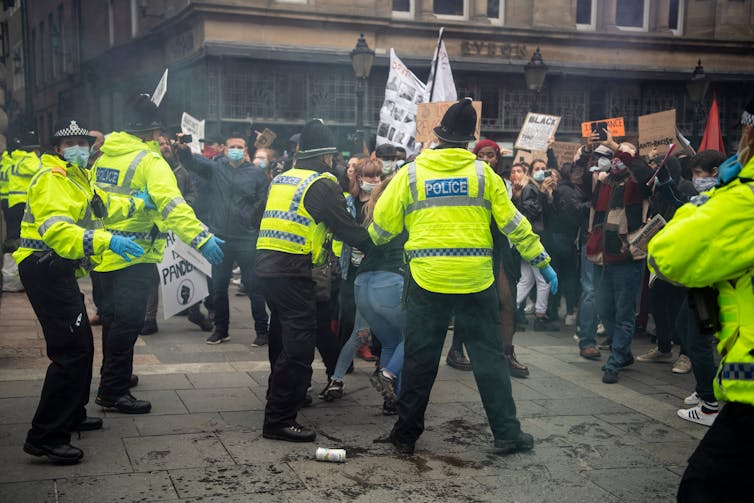 Police officers manage a violent protest by far right supporters in Newcastle city Centre.