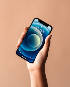 Someone holding up an iPhone