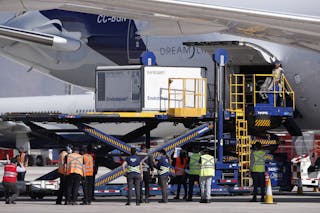 Sinovac COVID-19 vaccines being unloaded from a plane in Chile