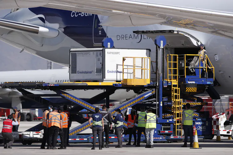 Sinovac COVID-19 vaccines being unloaded from a plane in Chile
