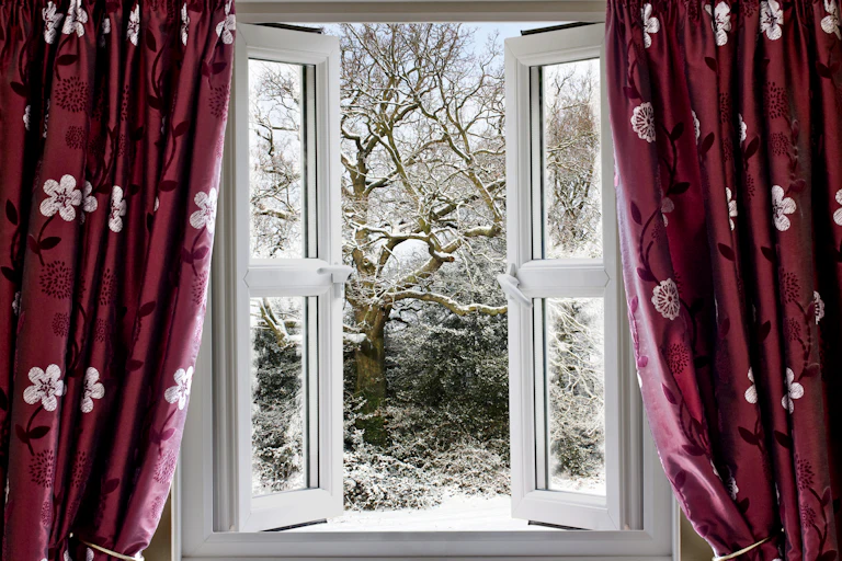 A window opens onto a snowy landscape.