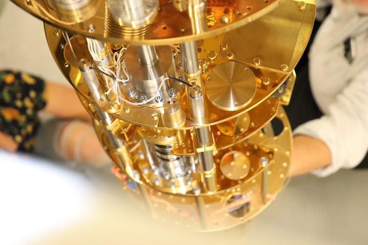 Shiny gold pipes and technology that surround the detector.