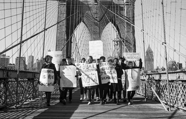 A group of activists call for the end of school segregation in New York City.