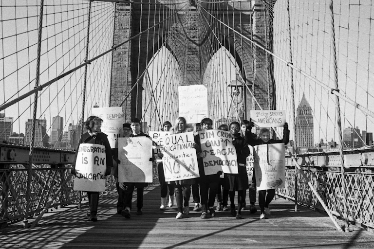 A group of activists call for the end of school segregation in New York City.