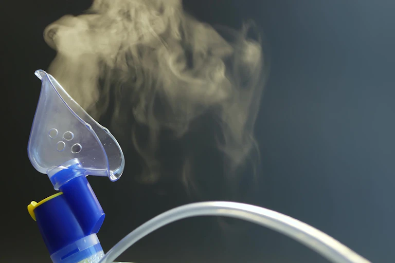 Nebuliser mask showing aerosols of medicine