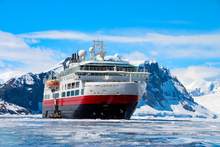 A huge cruise ship in icy Antarctic waters