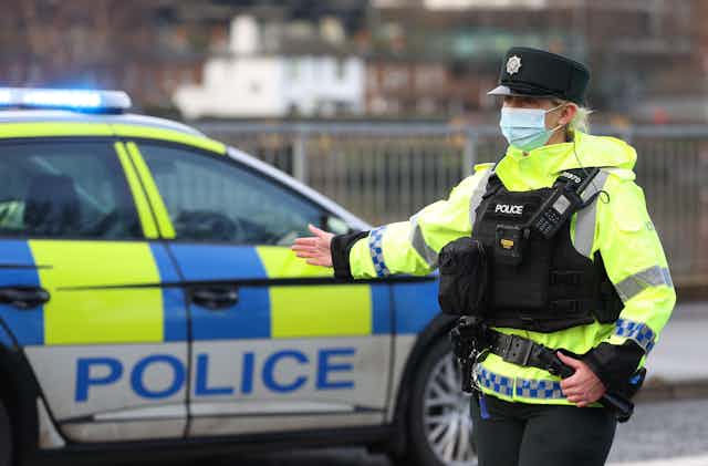 A police officer directing traffic in Belfast. 