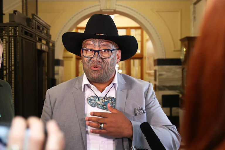 Rawiri Waititi wearing heitiki and cowboy hat