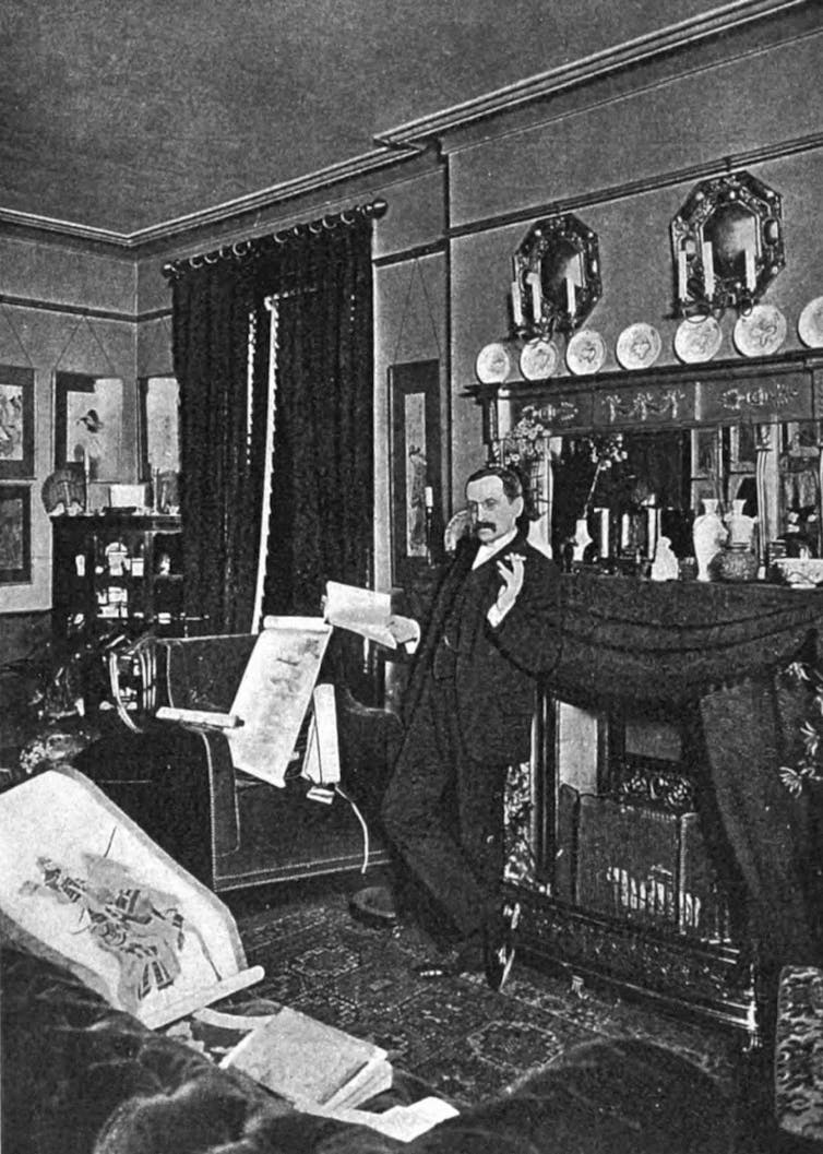 man in black and white photo in living room