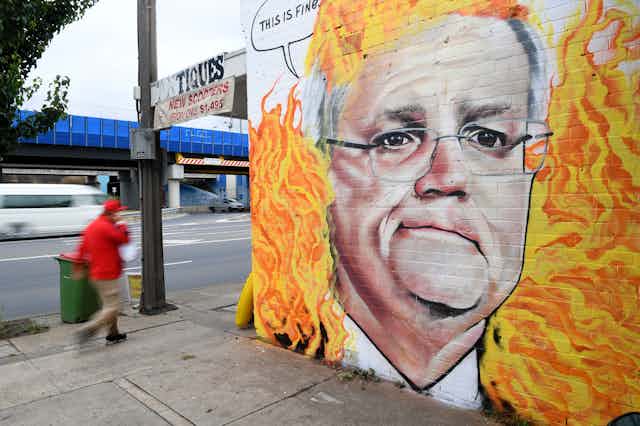 Mural of Scott Morrison surrounded by flames