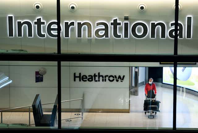 Passenger arriving at Heathrow Airport in London, England