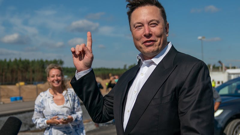 Elon Musk pointing at the sky