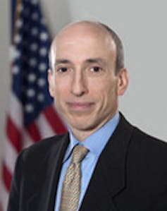 Gary Gensler portrait shot in front of US flag