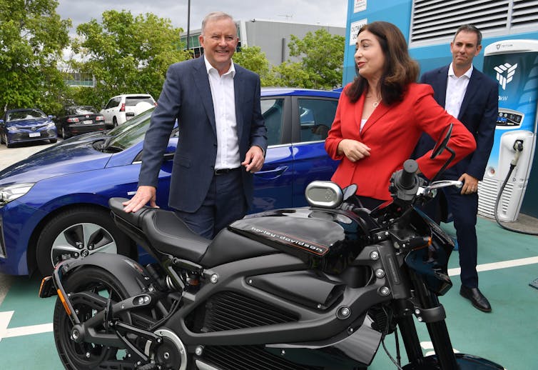 Anthony Albanese and Labor MPs Terri Butler and Jim Chalmers inspect a motorbike.