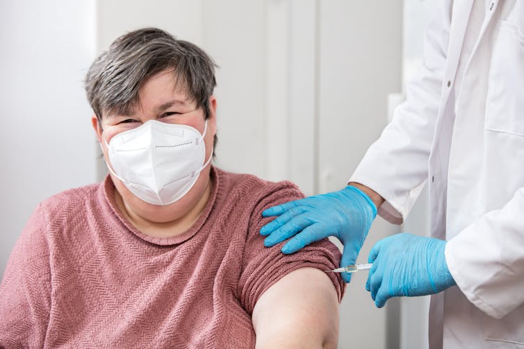 A woman with a developmental disability getting an injection