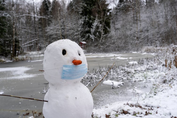 A snowman in a face mask.