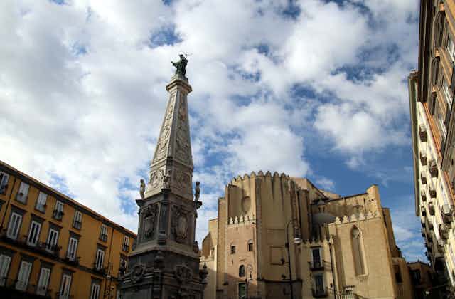 A column topped with a saint seen in Naples.