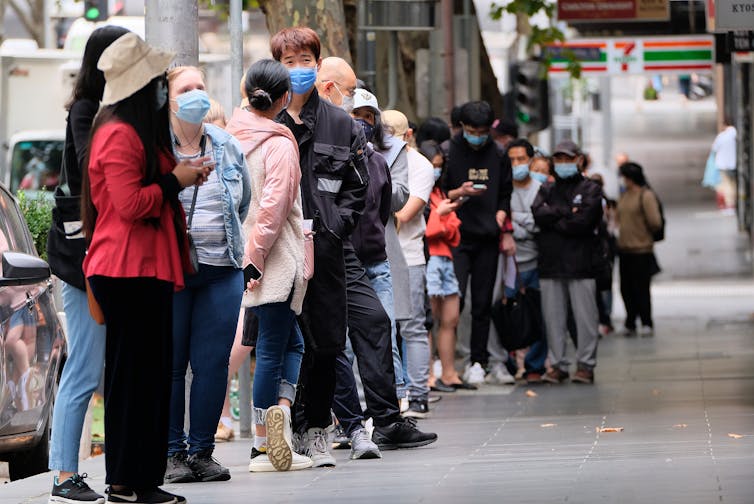 People queueing up in Melbourne to have a COVID test.