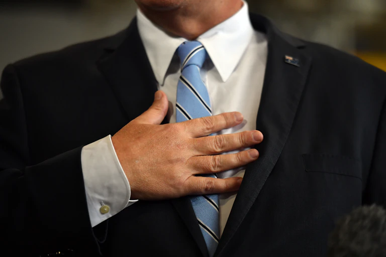 Man in suit with blue tie