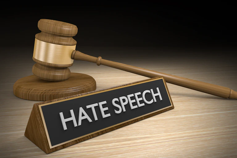 Graphic of gavel and sign saying "hate speech"