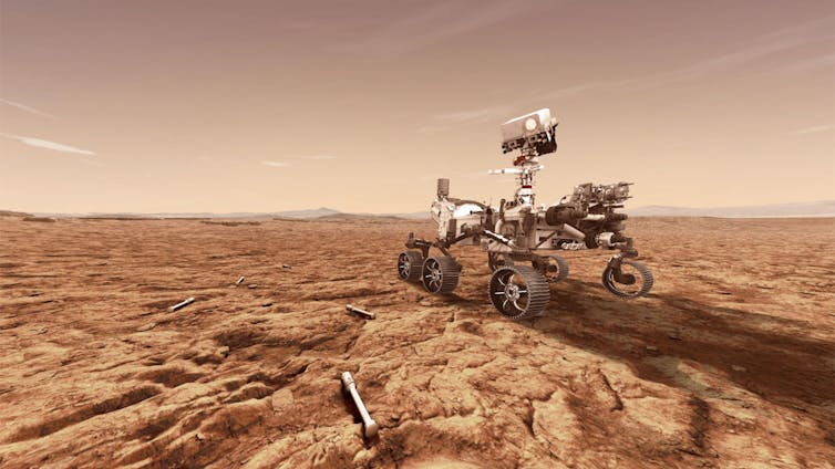 Artist's impression showing the rover on Mars with sample tubes around it on the ground.