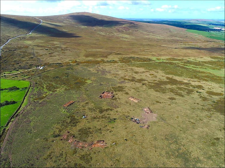 An aerial photograph of a green plain