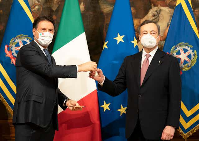 Giuseppe Conte and Mario Draghi are pictured at a ceremony to transfer power.