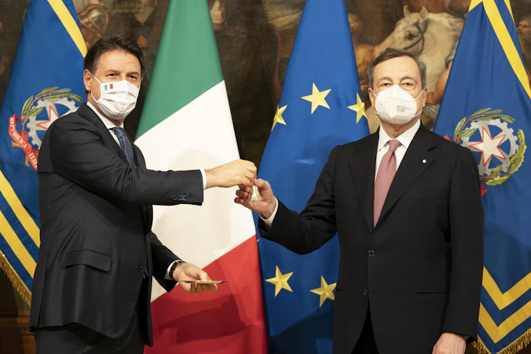 Giuseppe Conte and Mario Draghi are pictured at a ceremony to transfer power.