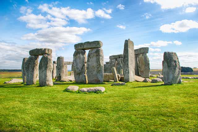 Stonehenge photographed against a blue sky