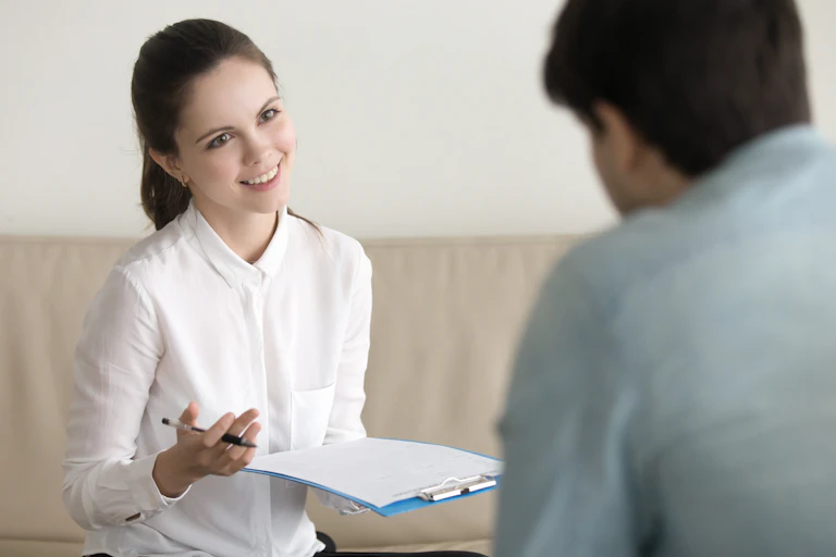 Management consultant questioning health worker