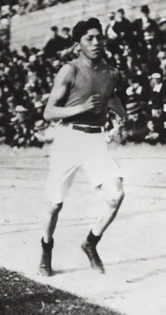 A black and white photograph of runner Tom Longboat on the track
