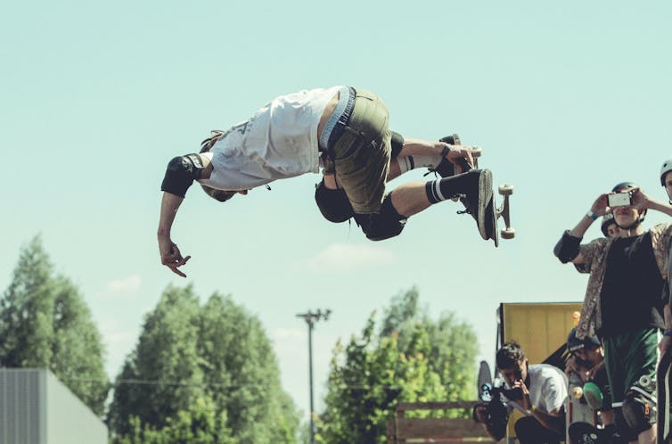 Young person in the air while rollerblading.