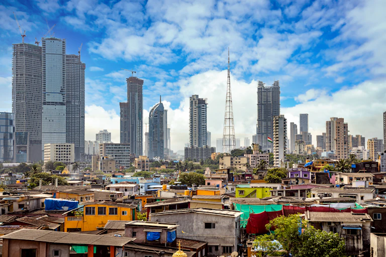 Slum in foreground, skyscrapers in background