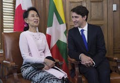 Aung San Suu Kyi shares a laugh with Justin Trudeau.