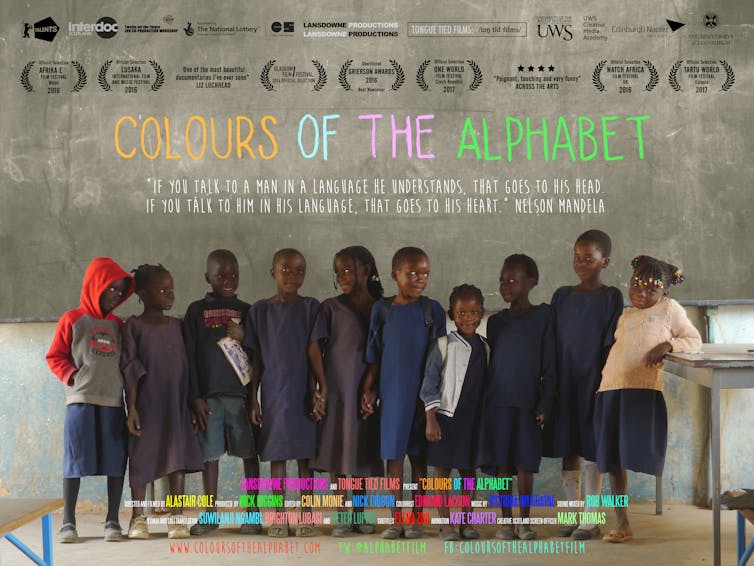 Film poster showing line of children in front of a blackboard.