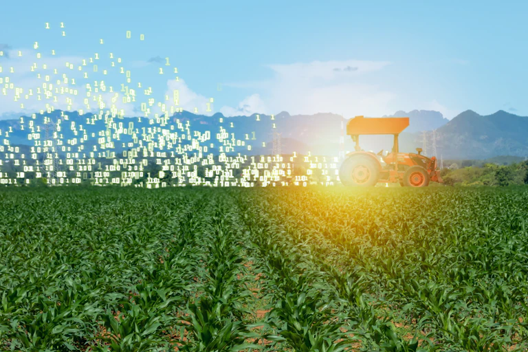 A tractor drives through a field kicking up data, instead of dust.
