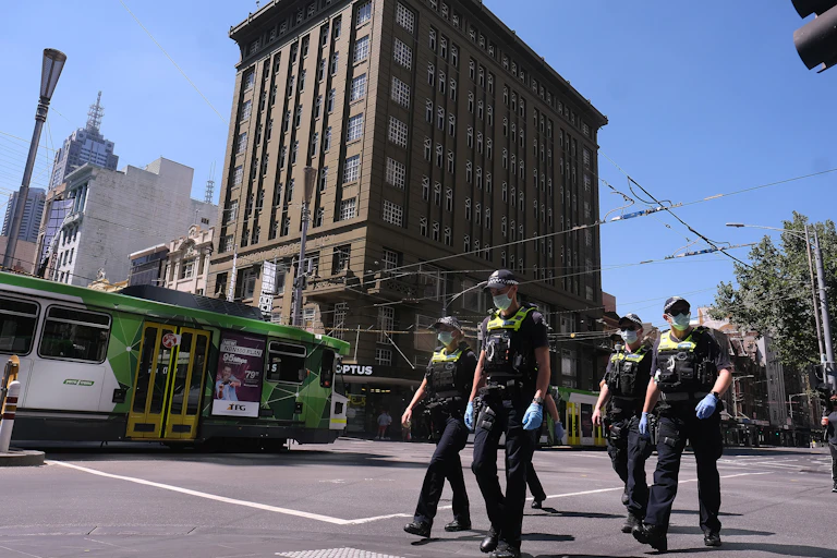 Victorian police officers walking in the streets of Melbourne