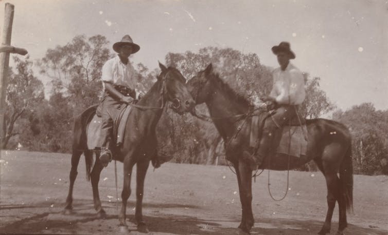 Two ben on horses.