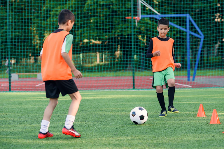Two boys playing football