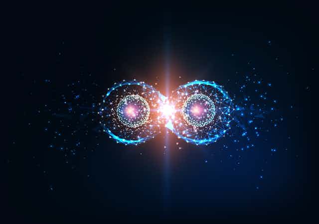 An image of quantum entanglement - two photons floating against a black background.