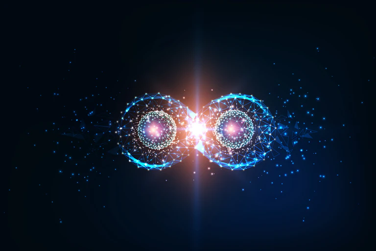 An image of quantum entanglement - two photons floating against a black background.