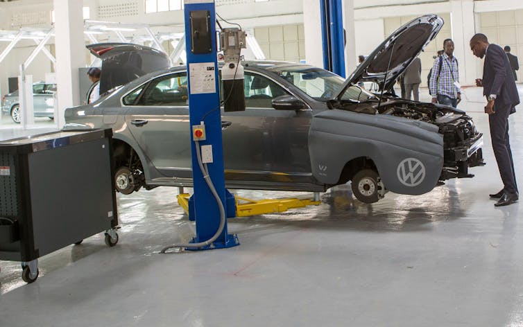 A worker examining a car at the Volkswagen factory in Kigali, Rwanda