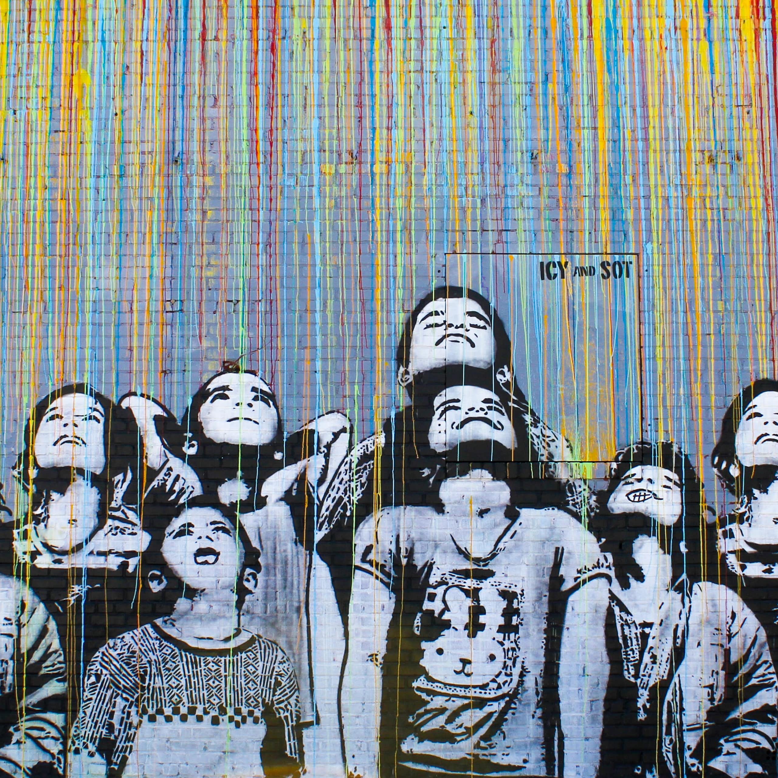 A graphic of schoolchildren painted on a wall. 