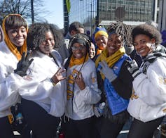 A group of African American women pose for a photo.